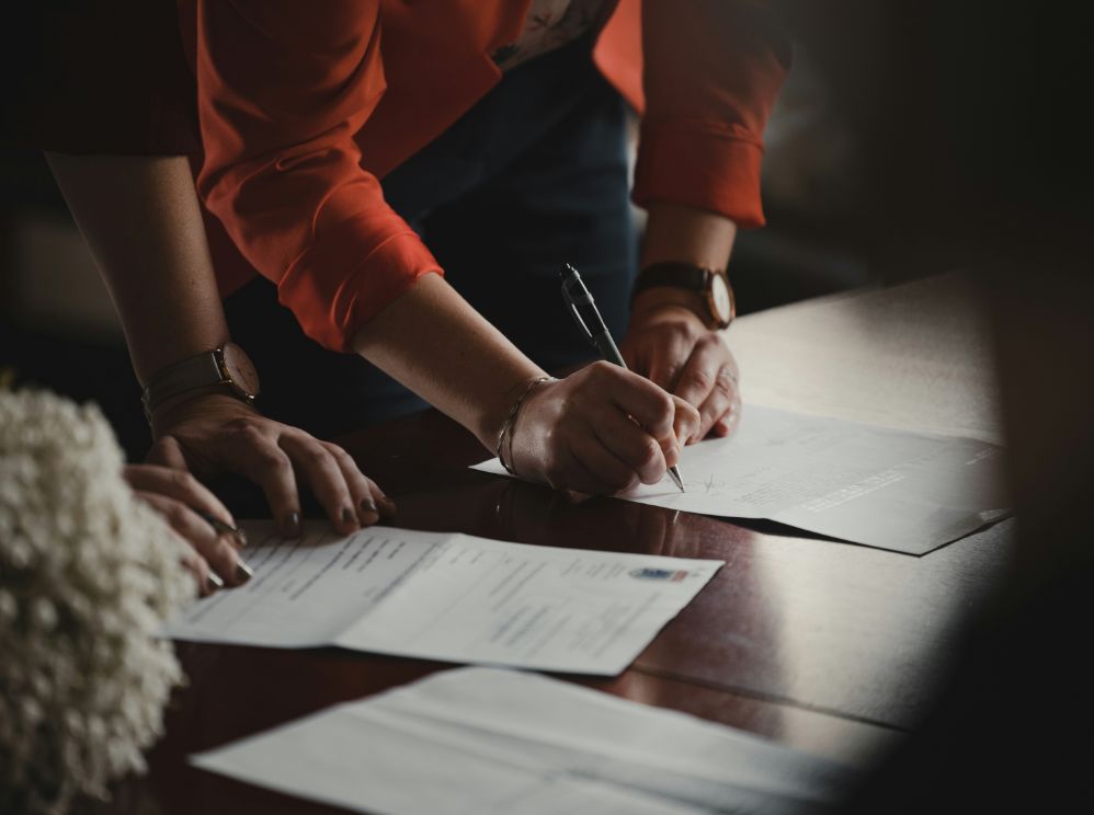 Legal professionals and Phoenix Social Security disability lawyers are reviewing paperwork prior to submitting documentation for a client seeking disability benefits.